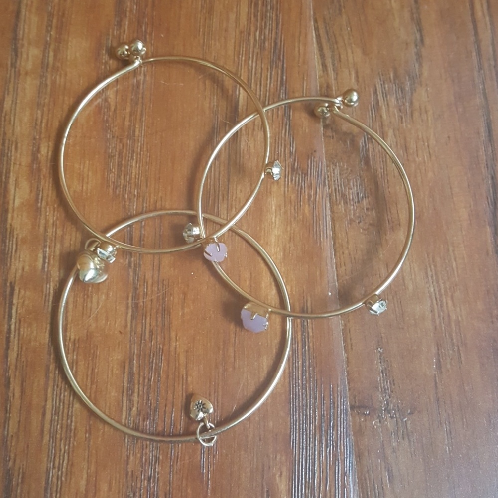 Three golden charm bracelets